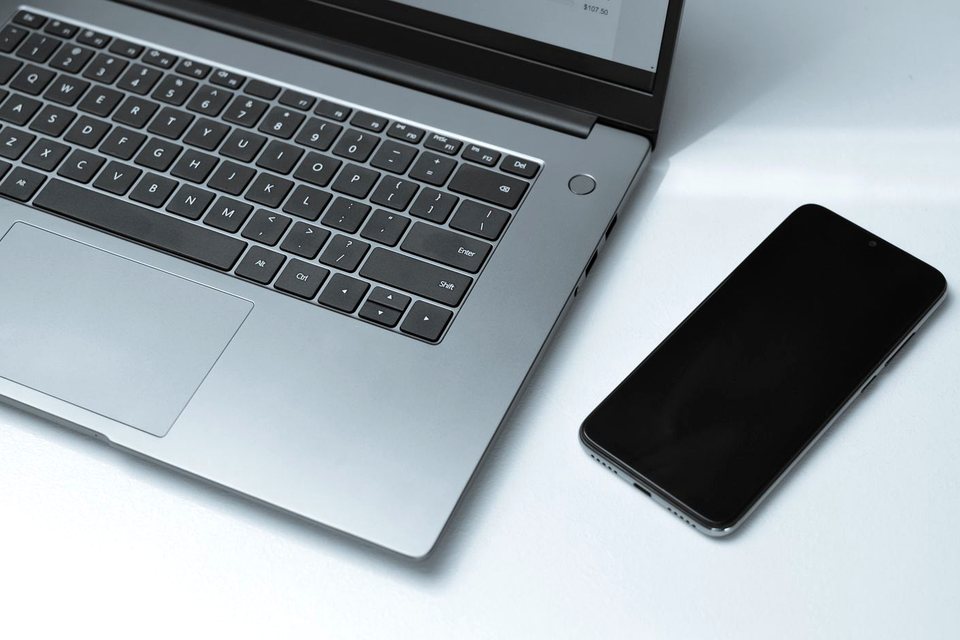 Laptop and smartphone on a desk